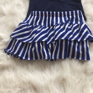 A blue shirt and a blue skirt